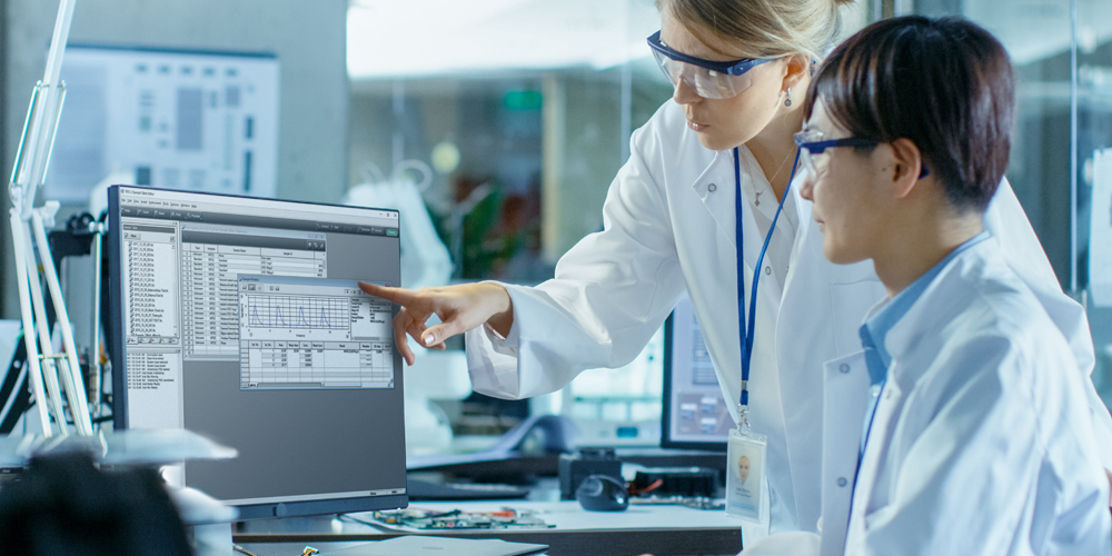 Scientists looking at PC
